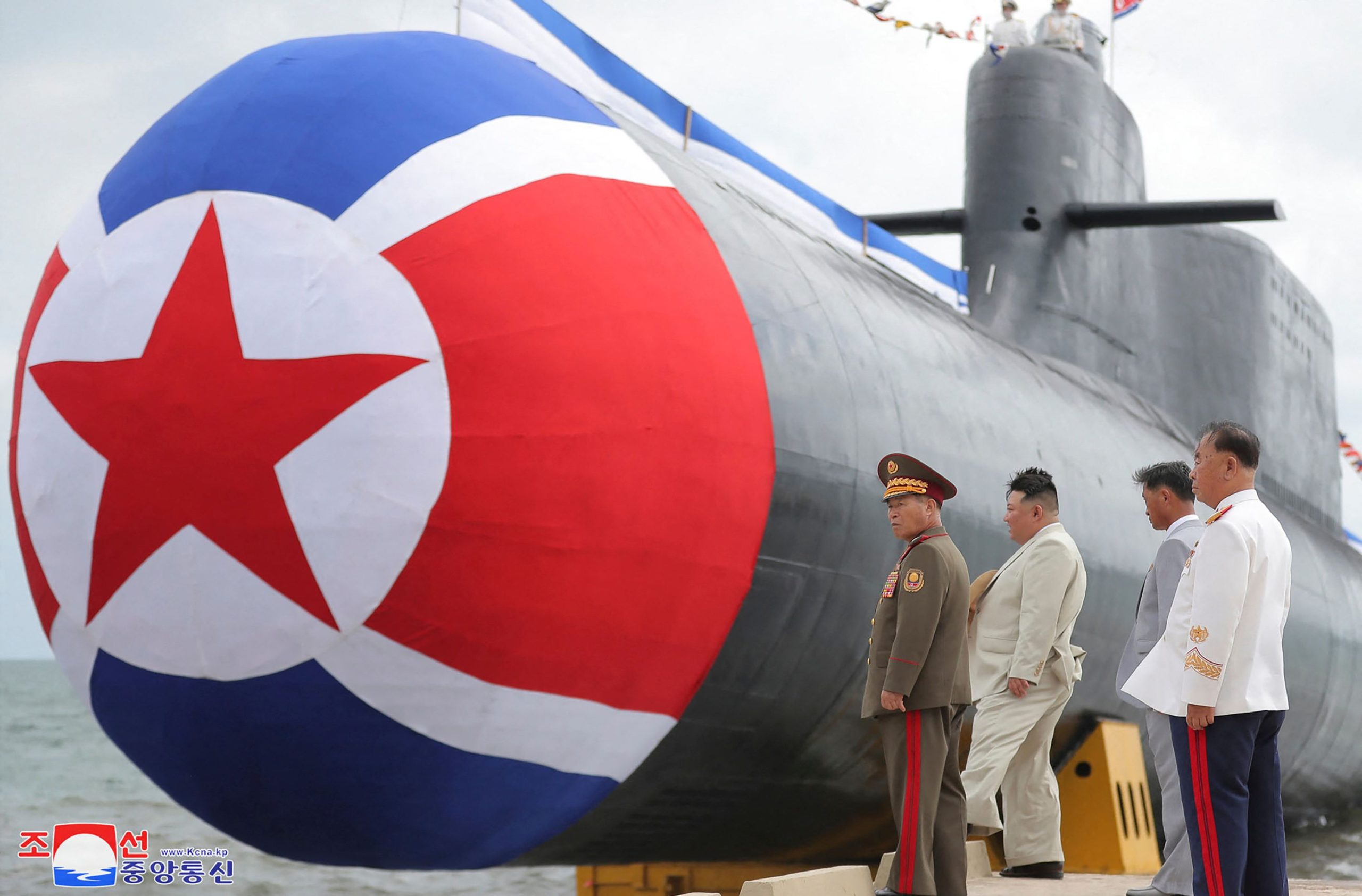 Kim Jong-un inspects a new North Korean submarine in images released by state media last September